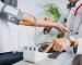 young-male-psysician-with-patient-measuring-blood-pressure_1303-17879